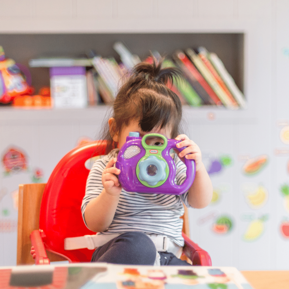 toddler learning photography - shooting from highchair bTanaphong Toochinda